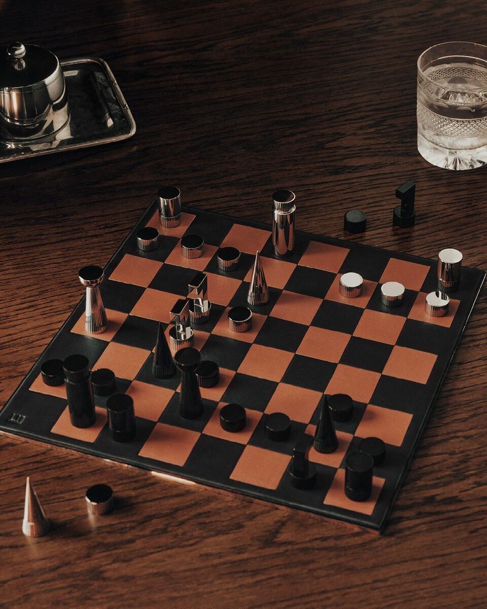 Leather chessboard with metal chess pieces